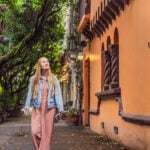A white woman strolls the streets of Condesa in Mexico City
