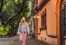 A white woman strolls the streets of Condesa in Mexico City