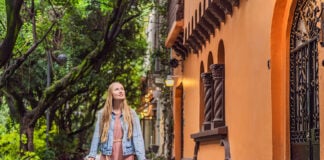 A white woman strolls the streets of Condesa in Mexico City