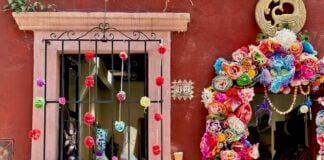 A doorway in San Miguel de Allende filled with flowers.
