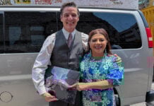 Mexico City Mayor Clara Brugada and actor Pedro Pascal pose with an axolotl figurine