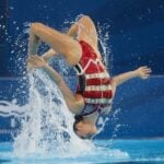 Fernanda Arellano backflips over water during her gold medal-winning duet with Joana Jiménez.