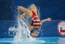 Fernanda Arellano backflips over water during her gold medal-winning duet with Joana Jiménez.
