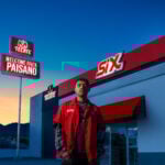 Welcome Back Paisano campaign image with a Mexican worker posing in front of a SIX store