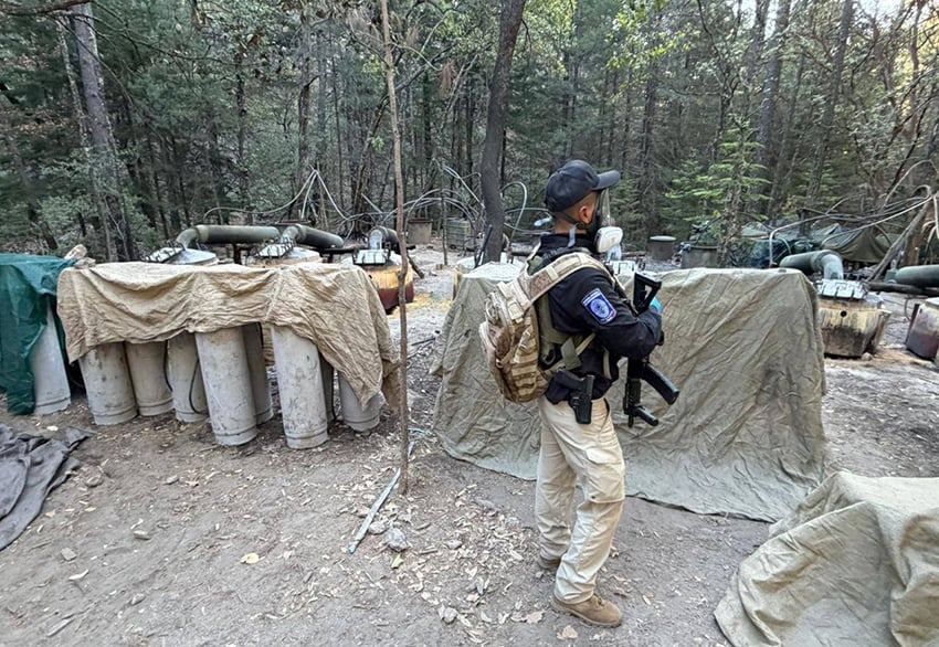 A Chihuahua security agent at the site of a recent drug lab raid