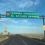 A highway sign says "Termina Chihuahua, El estado grande"