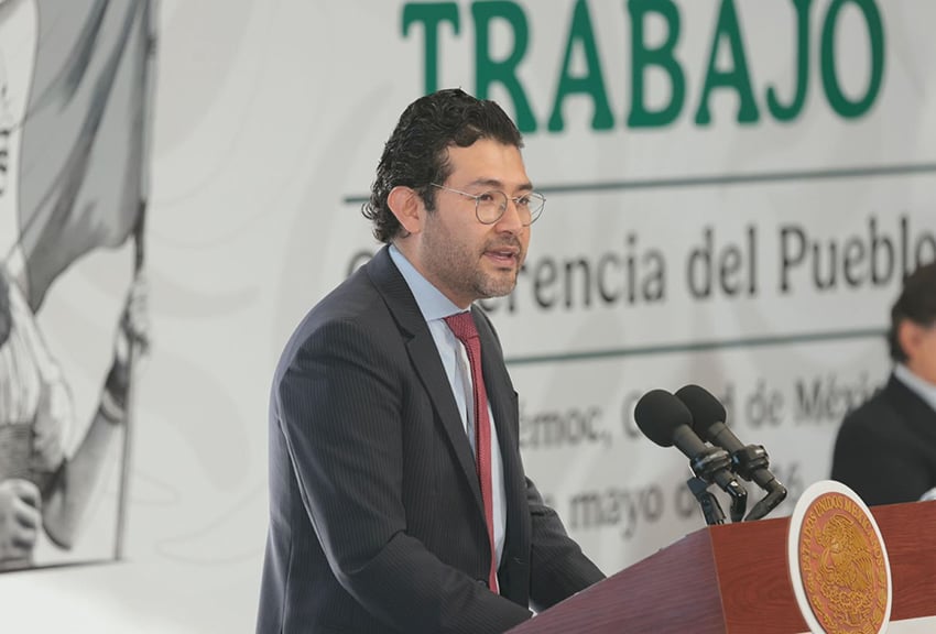 Labor Minister Marath Bolaños speaks at a perss conference