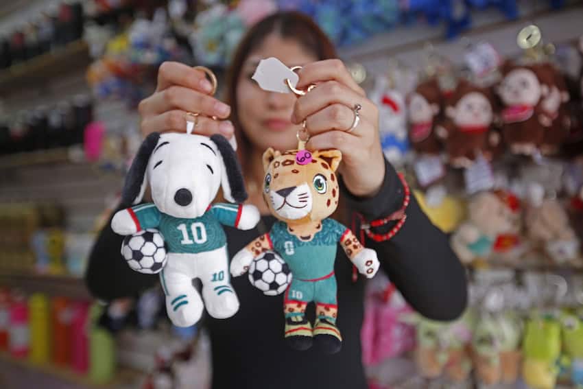 girl with WQorld Cup kick-knacks