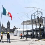 Workers install a FIFA Fan Fest stage in Mexico City's Zócalo plaza
