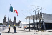 Workers install a FIFA Fan Fest stage in Mexico City's Zócalo plaza