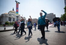 Members of the CNTE teachers union march past Mexico City's Palacio de Bellas Artes on Tuesday.