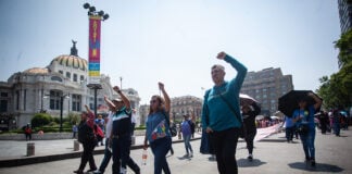 Members of the CNTE teachers union march past Mexico City's Palacio de Bellas Artes on Tuesday.