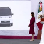 Olinia Project Coordinator Roberto Capuano Tripp shares a slide showing an Olinia vehicle, as President Claudia Sheinbaum looks on