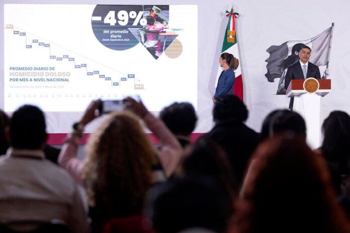 Security Minister Omar García Harfuch presenting at President Sheinbaum's morning press conference