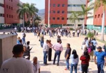 People evacuated from a building following an earthquake