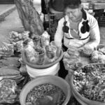 A woman selling food in the street