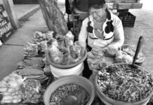 A woman selling food in the street