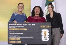 President Sheinbaum poses with juggling contest winner Yolett Cervantes and a giant World Cup ticket