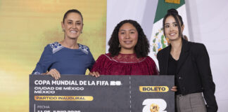 President Sheinbaum poses with juggling contest winner Yolett Cervantes and a giant World Cup ticket