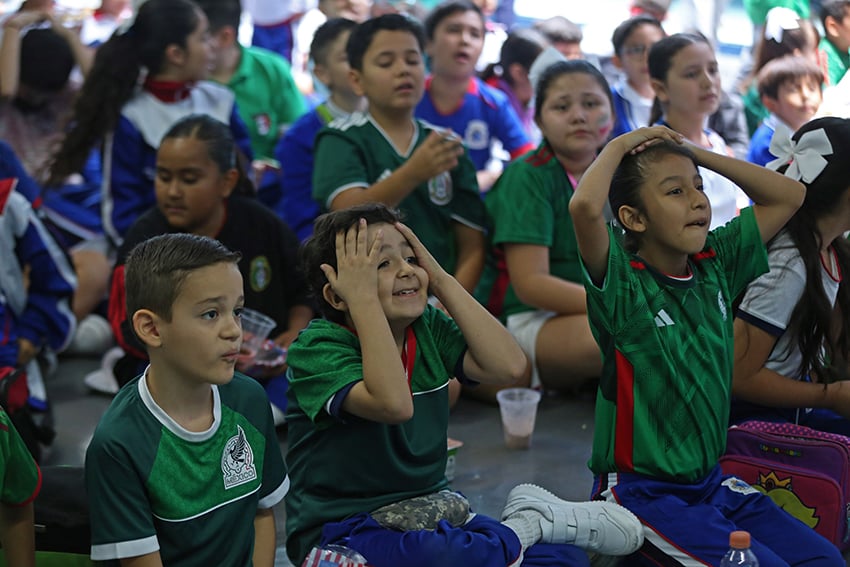 Students watch Mexico tie with Poland during the 2022 World Cup.