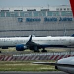 a plane on the tarmac at Mexico City Benito Juárez