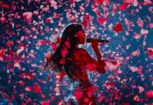 Dua Lipa sings surrounded by confetti on stage in Mexico City