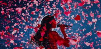 Dua Lipa sings surrounded by confetti on stage in Mexico City