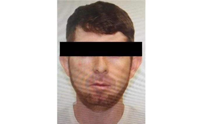 A mug shot of Isaí "El Chinacate" Martínez Cepeda with his eyes blacked out for privacy