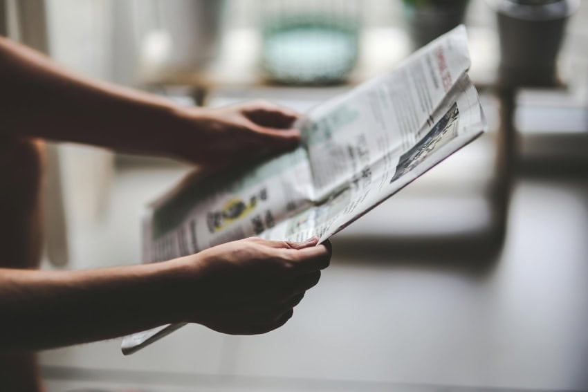 Someone reading a newspaper