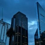 Reforma Avenue with a rainstorm overhead