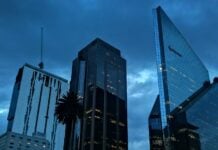 Reforma Avenue with a rainstorm overhead