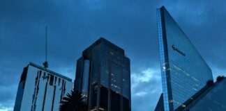 Reforma Avenue with a rainstorm overhead