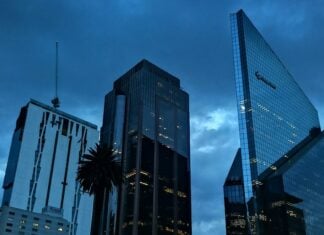 Reforma Avenue with a rainstorm overhead