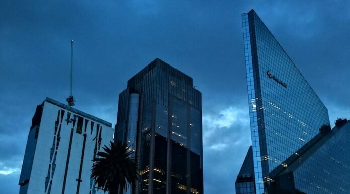 Reforma Avenue with a rainstorm overhead