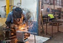 A welder works in a metal shop in Mexico