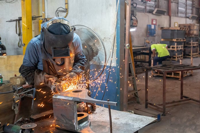 A welder works in a metal shop in Mexico