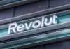 Revolut logo signboard on modern office building in Vilnius, Lithuania on May 30, 2021. Revolut is financial technology company that offers banking services