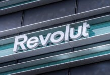 Revolut logo signboard on modern office building in Vilnius, Lithuania on May 30, 2021. Revolut is financial technology company that offers banking services