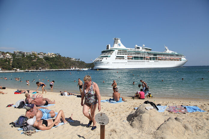 Tourists on the beach in Huatulco, Oaxaca