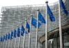 European Union Flags Waving In Brussels Opposite The European Commission Building