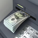 An ATM accepts a deposit of US dollar bills