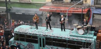 U2 atop bus
