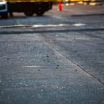 shattered glass on a roadway from a shootout