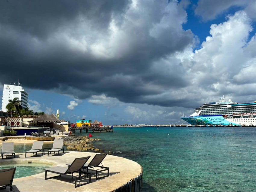 A cruise ship at the Cozumel docks, with the town of Cozumel in the foreground