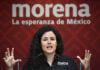 Morena Party President Luisa María Alcalde at a podium in front of a Morena banner