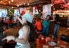 Patrons of a bar celebrate a World Cup match