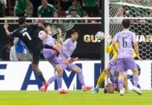 Luis Romo pushes the soccer ball though a tangle of four South Korean defenders, into the goal