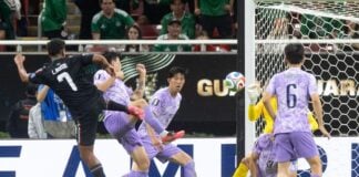Luis Romo pushes the soccer ball though a tangle of four South Korean defenders, into the goal