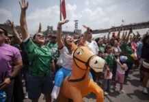 Mexican fans celebrate in a FIFA Fan Fest