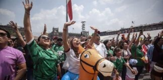Mexican fans celebrate in a FIFA Fan Fest